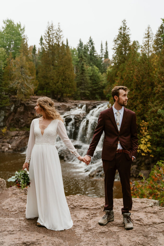 Post-ceremony, the adventurous trio embarks on a scenic 2.5-mile hike through Gooseberry Falls, capturing moments against emerging fall colors.