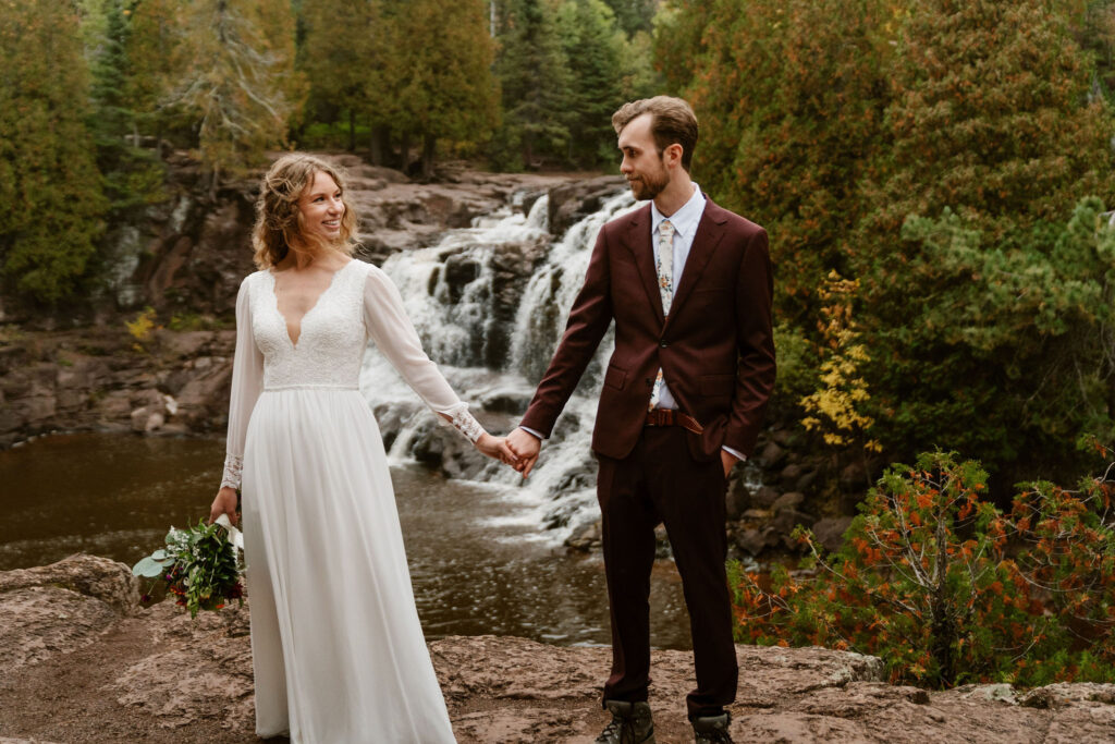 Annie and Josiah embrace in a heartfelt moment during their intimate Lake superior north shore elopement at Gooseberry Falls State Park.