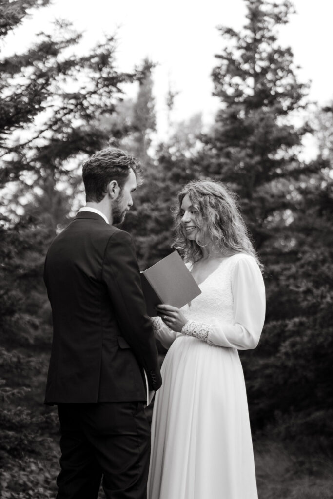 Sharing laughter, stories, and a toast with beers, Annie and Josiah read their personal vows to each other, followed by a romantic first dance amid the towering pines.