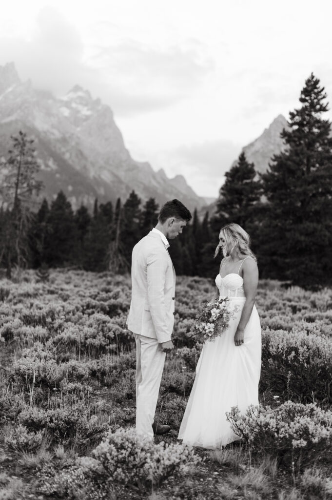 Cam and Ashley embrace at sunrise in Grand Teton National Park at Cascade Canyon.