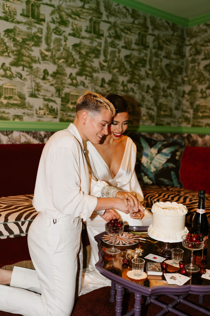 Two brides cut their elopement cake