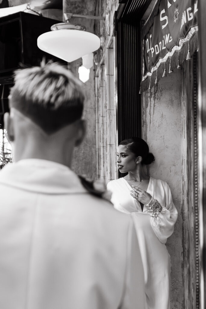 Two brides stand in an alleyway for their San Diego elopement