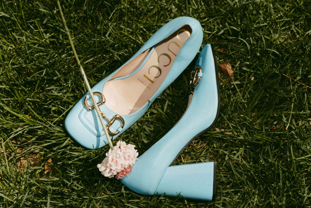 Blue Gucci block heels laying in the grass