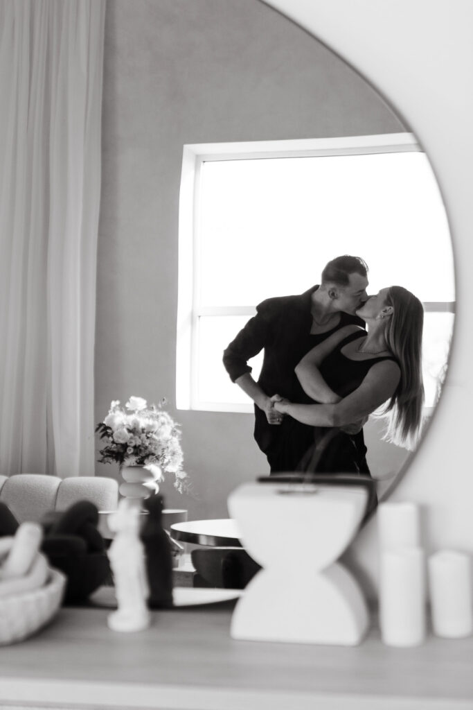 Couple dancing together in a mirror