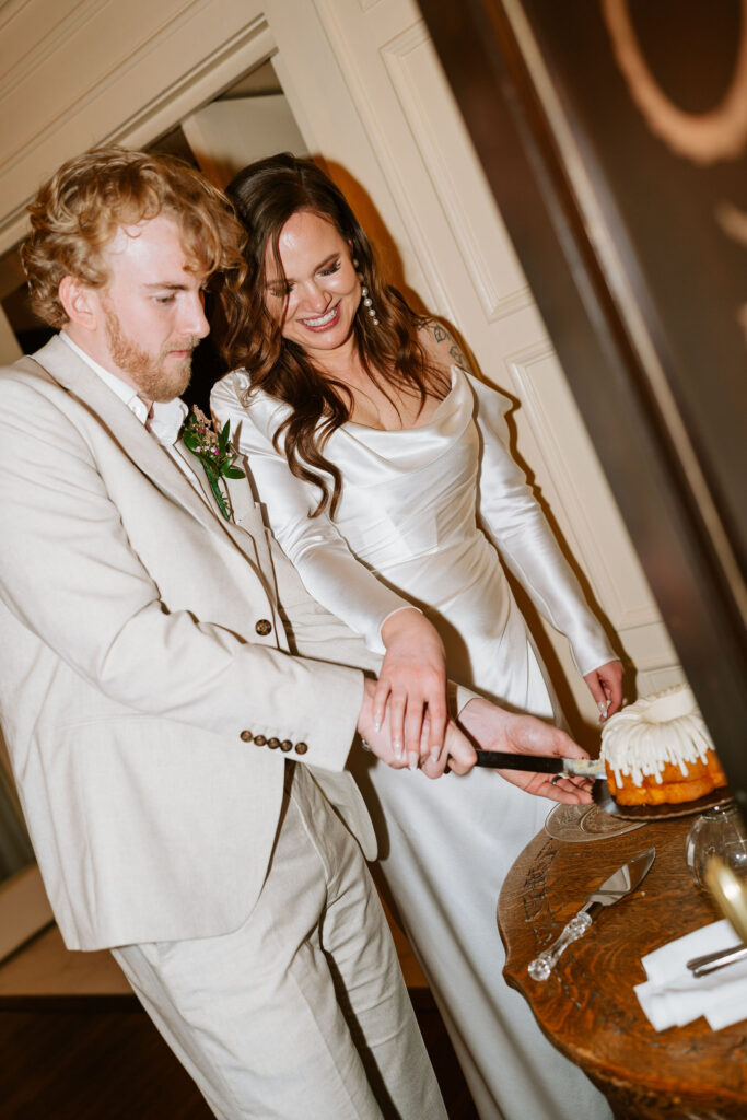 Bride and groom cut their wedding bundt cake