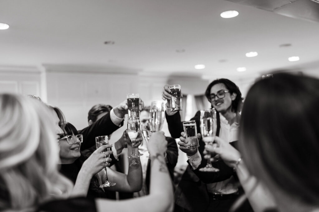 Family and friends make a toast during cocktail hour