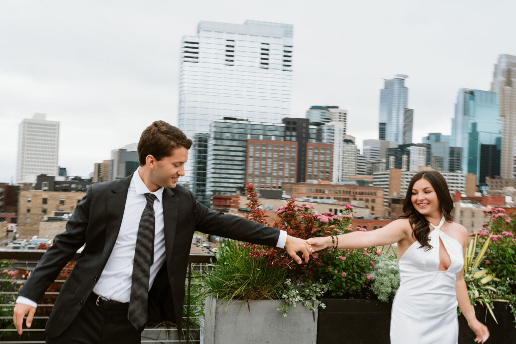 Rooftop engagement photos in downtown Minneapolis