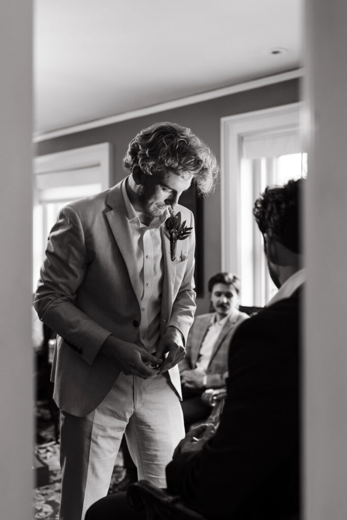 Groom getting ready in the groom suite