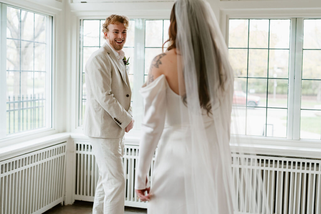 Bride and groom first look in St. Paul College Club