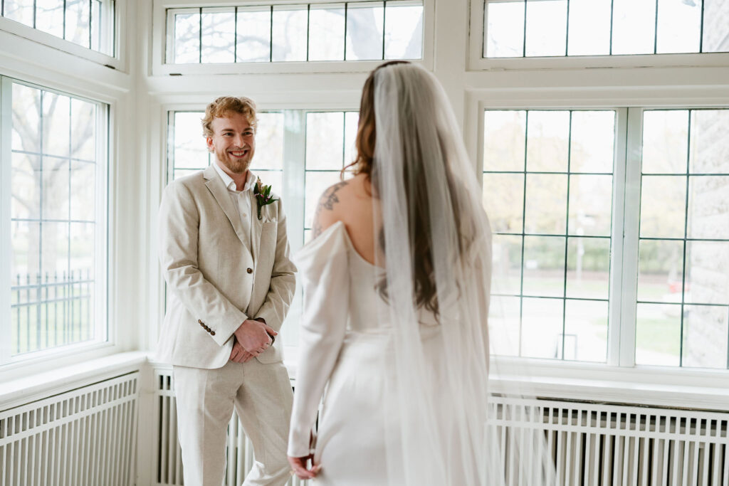 Bride and groom first look in St. Paul College Club