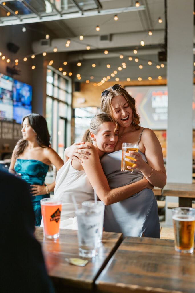 Documentary style wedding reception photos at a local bar in St. Paul