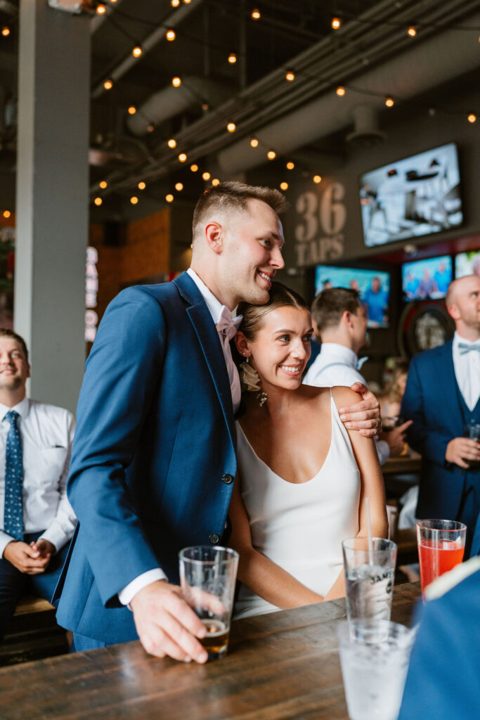 Documentary style wedding reception photos at a local bar in St. Paul