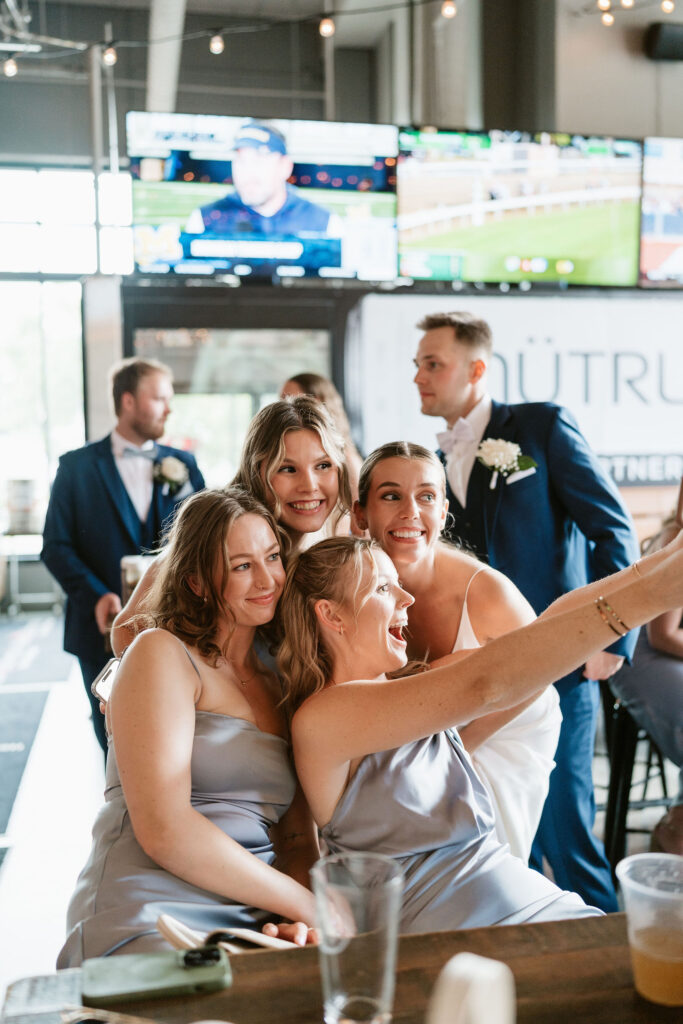 Documentary style wedding reception photos at a local bar in St. Paul