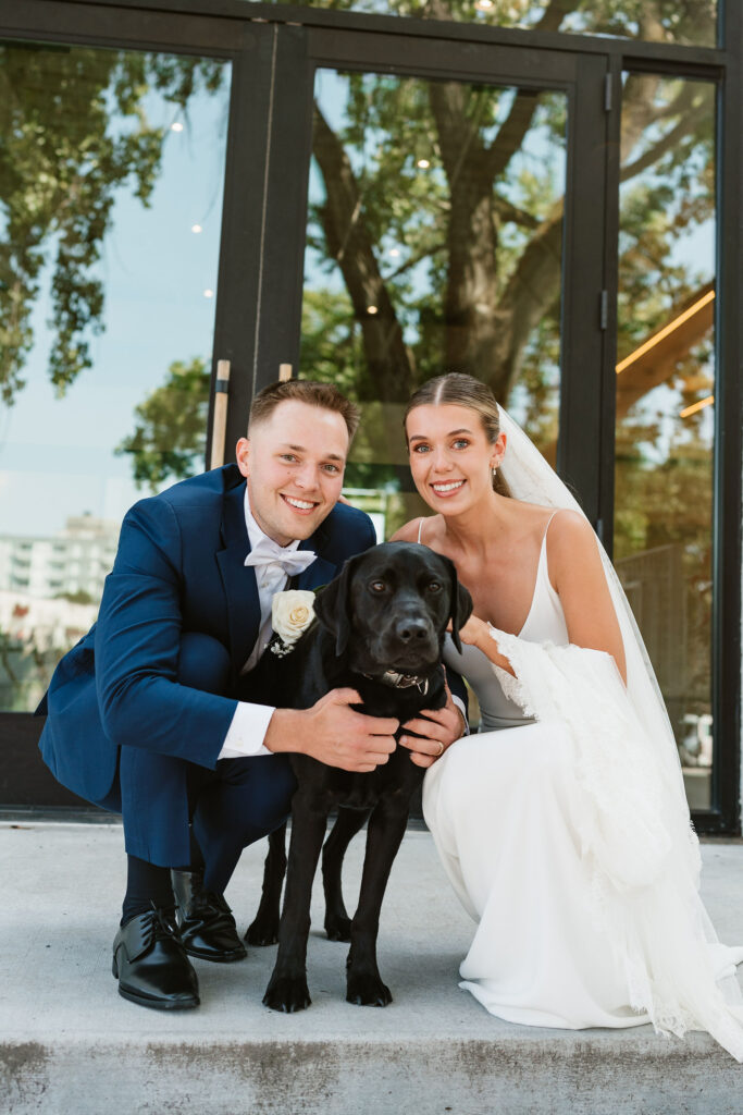 Documentary style photos as groom surprises bride with their dog