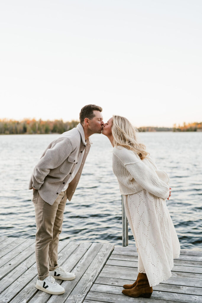 Couple takes fall engagement photos on the dock at Lake Vermilion