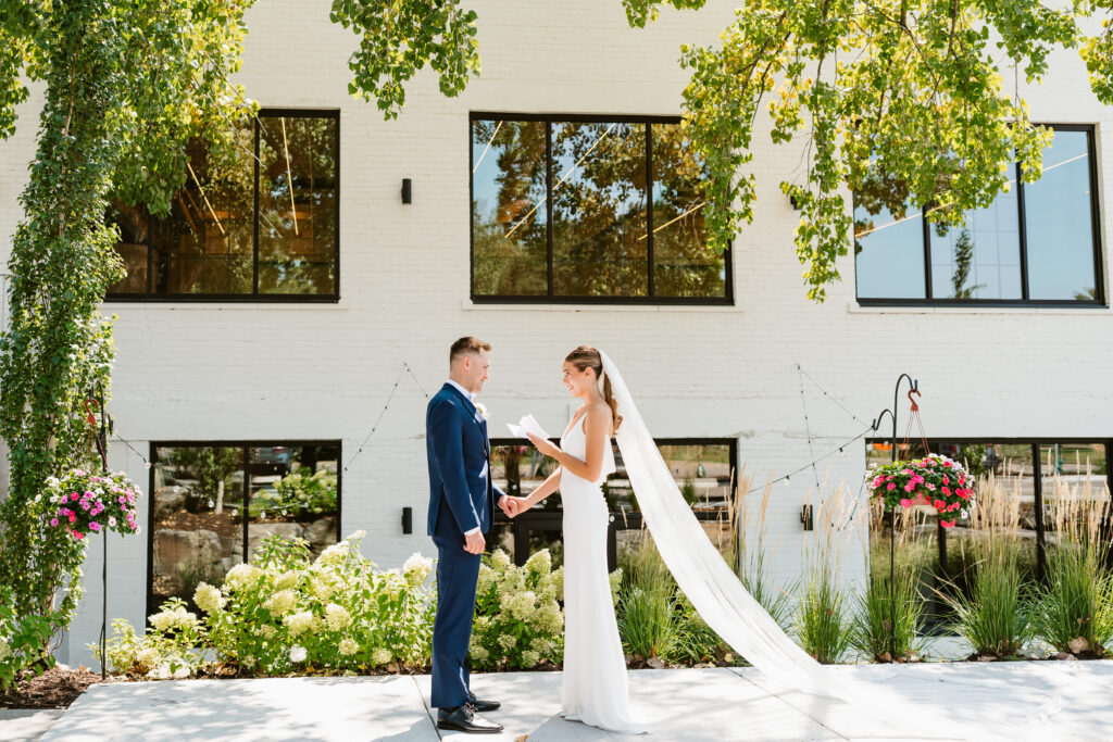 Hanna and Brett exchange their vows outside of the Twin Cities wedding venue The Lowlands.