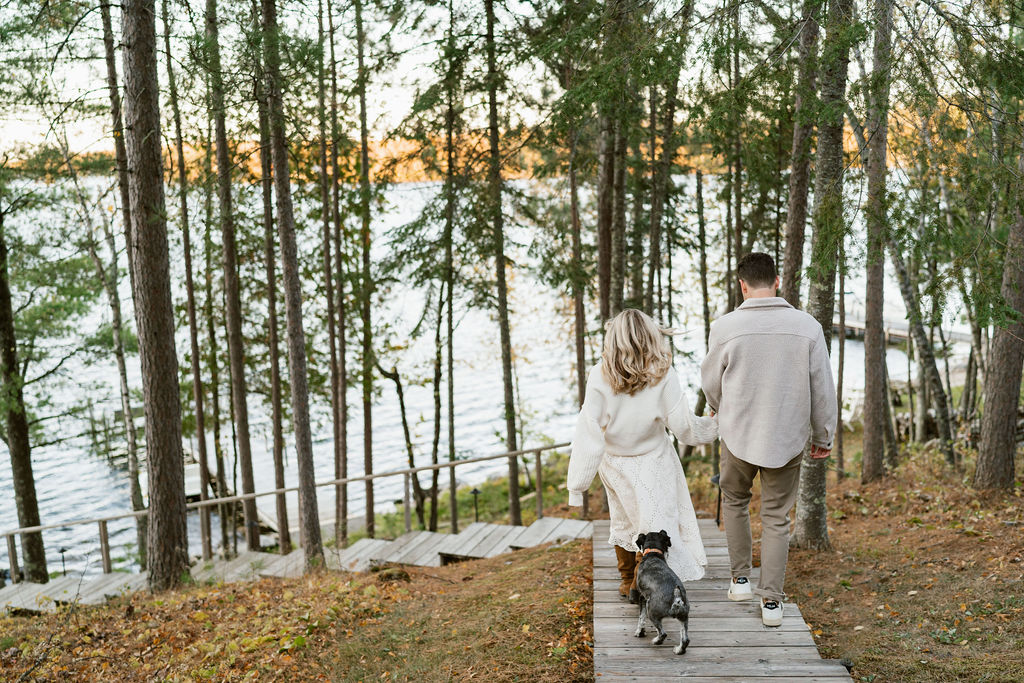 Couple takes engagement photos in the fall foliage at their family's Minnesota cabin on the lake