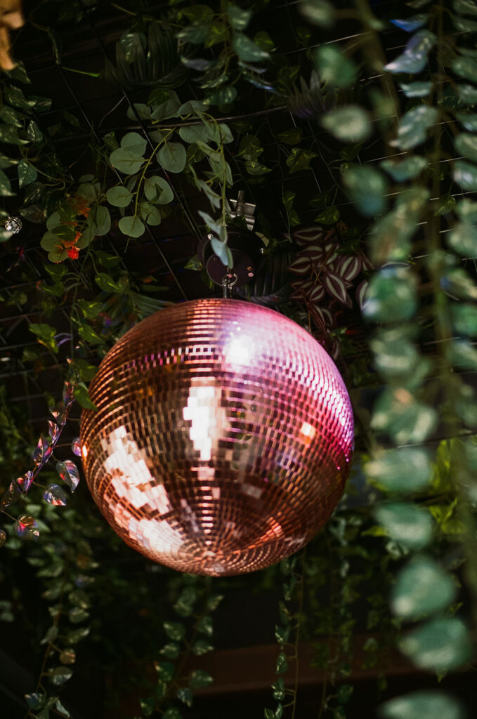 Greenery and disco balls hang in Green Room Minneapolis