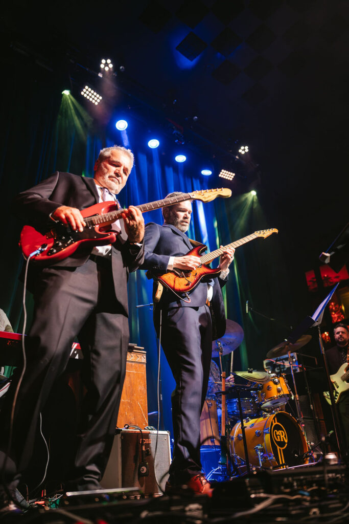 Groom and family perform on stage at Green Room Minneapolis