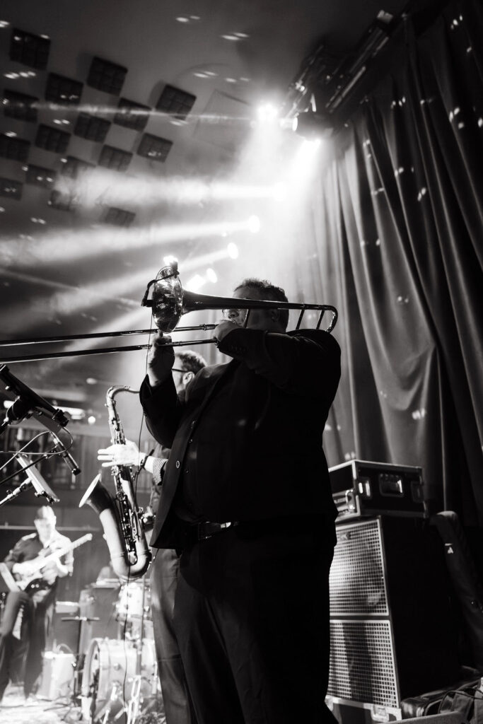 Groom and family perform on stage at Green Room Minneapolis