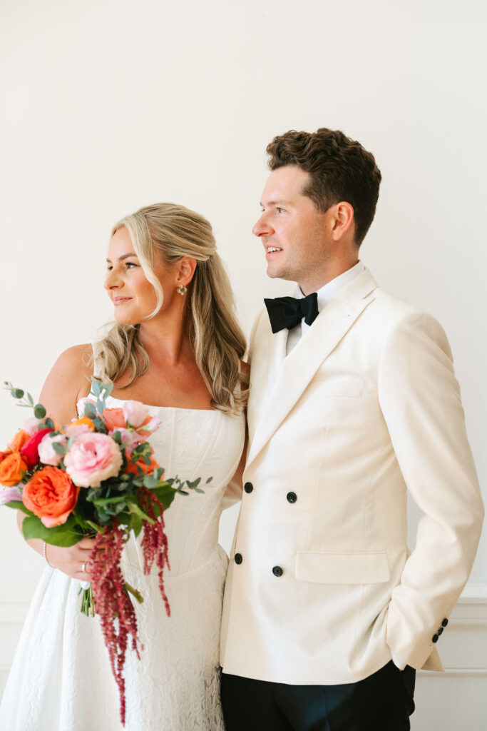 Bride and groom photos at Minneapolis Club with colorful florals