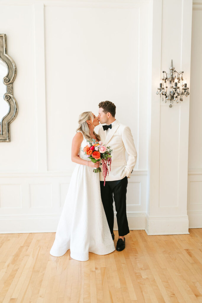 Bride and groom photos at Minneapolis Club with colorful florals