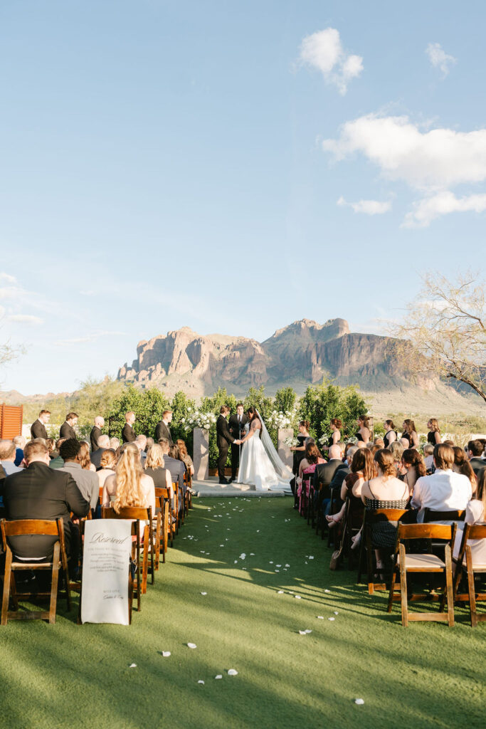 Arizona desert wedding ceremony at The Paseo with the Superstition Mountains in the backdrop