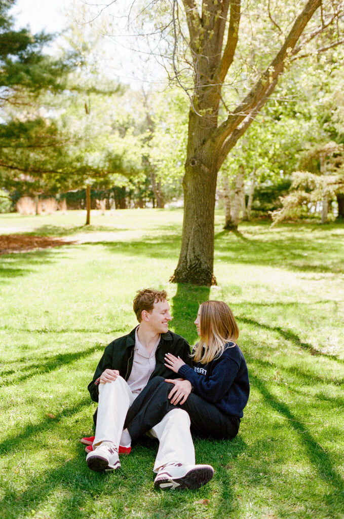 Spring engagement photos at Noerenberg Gardens after a lakeside proposal
