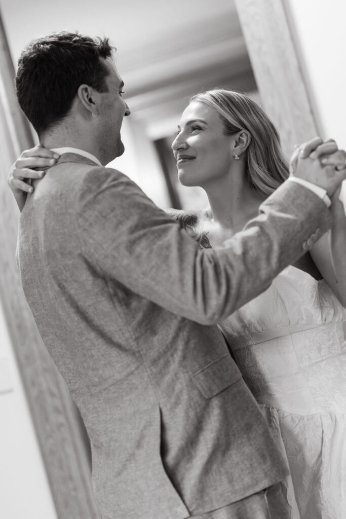 Bride and groom dance in the foyer of a private estate in St. Paul MN
