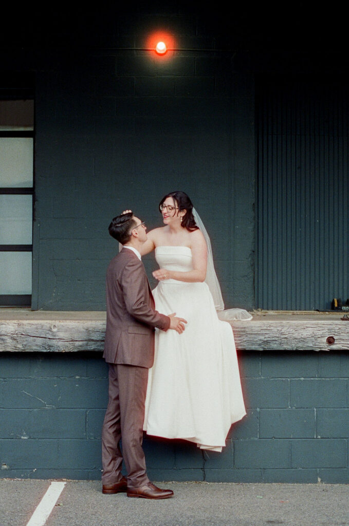 Industrial-style bride and groom portraits in St. Paul Minnesota captured on 35mm film